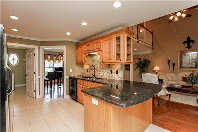Recently updated kitchen with Granite and Travertine tile backsplash