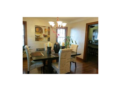 The hardwood floors continue into the formal dinin