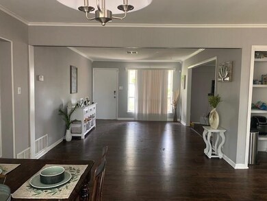 Dining Room looking towards a 2nd living room and front door.
