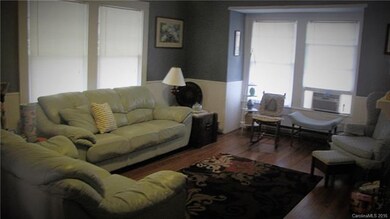 Living room. Nice bay window.