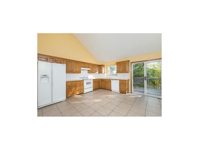 Freshly painted kitchen with vaulted ceiling and w