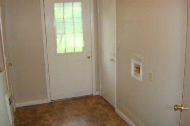 Huge utility room with door to the back yard; access to the hall; access to the master bath