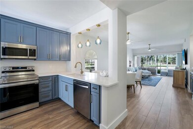 Kitchen with light countertops, stainless steel ap