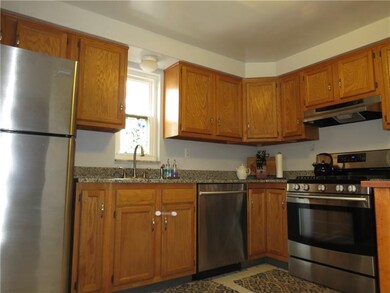 Gleaming stainless steel appliances, granite count