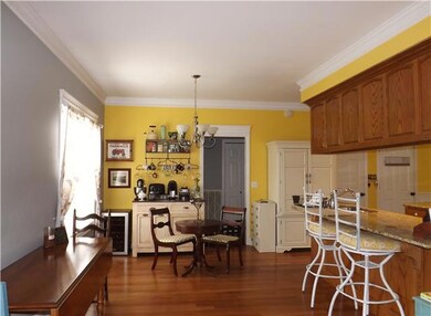 A large gathering area is located adjacent to the eating bar & opens to the Great Room.It is perfect space for a breakfast room and/or bar area.