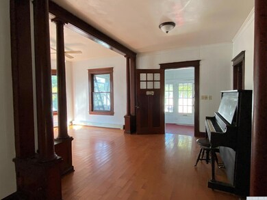 Entry Room looking into Living Room & onto Enclose