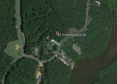 Google Earthed It. House already built to left.