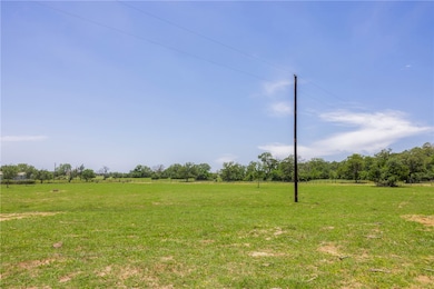 View of grassy yard featuring a view of countrysid
