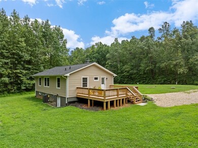 Back of property featuring a deck, central air con