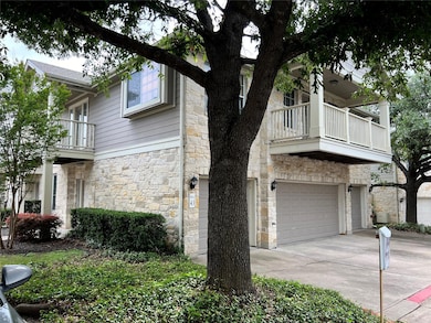 View of front of house featuring a balcony, stone