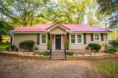 Ranch-style house with a metal roof
