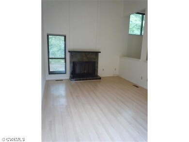 Living Room - Wood burning FP and Vaulted Ceiling