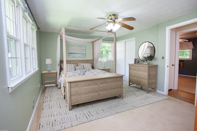 How inviting is this primary bedroom plus it has two closets and opens to full bath