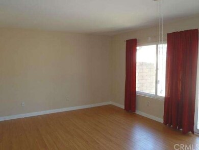 Family room has laminate flooring, attractive base