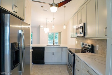 Kitchen featuring light tile patterned floors, vis