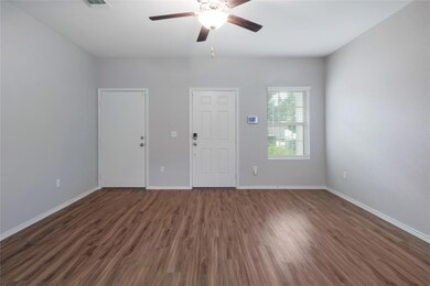 Empty room featuring wood finished floors and a c