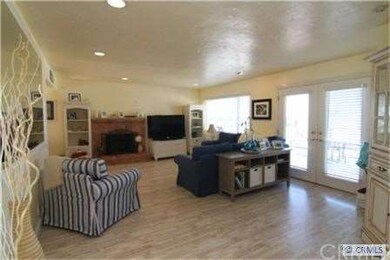 Spacious open living room with fireplace, lots of 