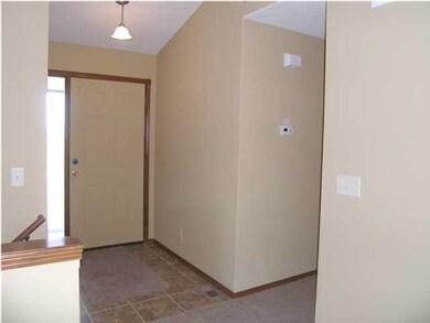 Ample area to greet guests in the tiled entry.