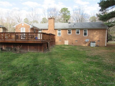Rear view of property featuring cooling unit, a de