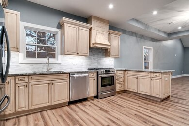 LVT throughout kitchen and main part of the home for elegance and easy maintain..