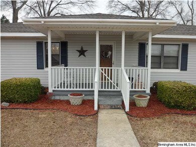 You will love this covered country front porch!