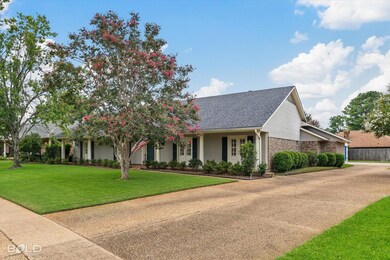 View of front of house with a front yard