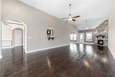 Over sized main living with hardwood floors