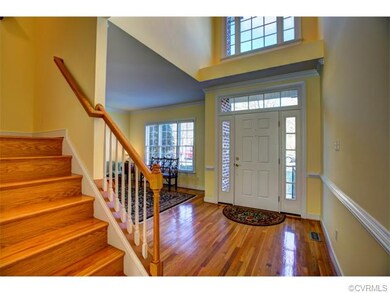 Open Transitional Entrance foyer. Wood floors are 
