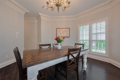 Just off the entry, the elegant dining room featur