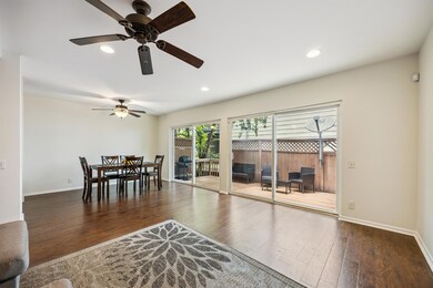 Dining space with ceiling fan, wood finished floo