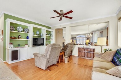 Family room with built in cabinetry and shelving