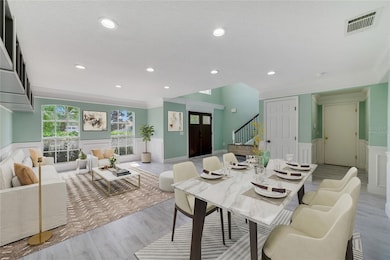 There are BUILT-IN FEATURES throughout, starting in the flexible formal living and dining spaces complete with a lovely wainscoting detail and crown molding! Virtually Staged.