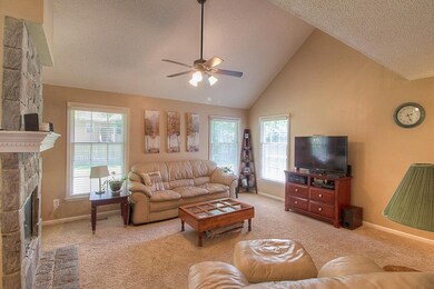 Large family room with vaulted ceiling, built in b
