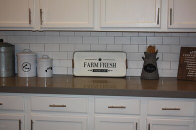 white cabinets and grey quartz counters