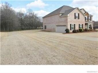 SIDE LOADING 2 CAR GARAGE AND LEFT SIDE VIEW INTO BACK YARD