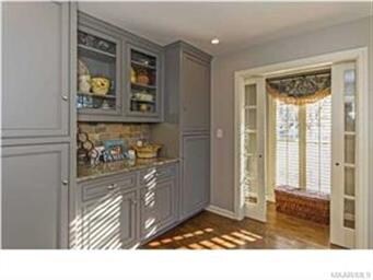 A CLOSE-UP OF THE BUTLER'S PANTRY AND ENTRANCE INT