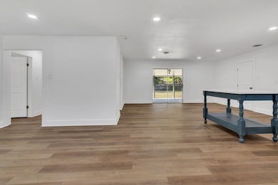 Living room featuring recessed lighting and light wood-type flooring