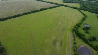 Birds eye view of property with a rural view