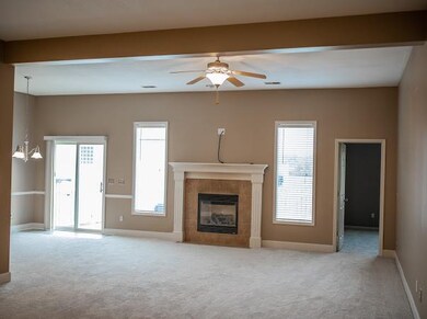 Formal dinning room with fire place open to breakf