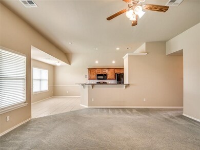 NATURAL LIGHT FILLS THE OPEN FAMILY AREA, KITCHEN 