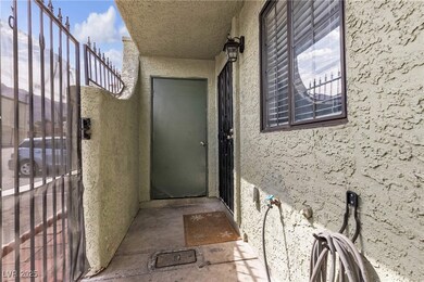Property entrance featuring stucco siding