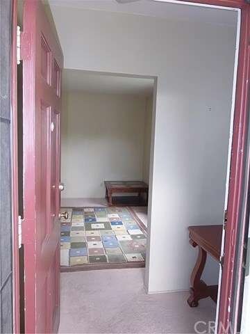 Standing at the front door you see the foyer where