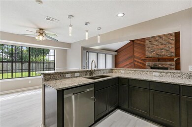 Kitchen open to den and dining