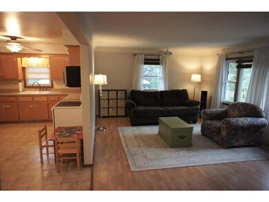 The spacious living room right off the kitchen