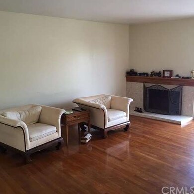 Living Room with Fireplace.  Hardwood Floors throughout!