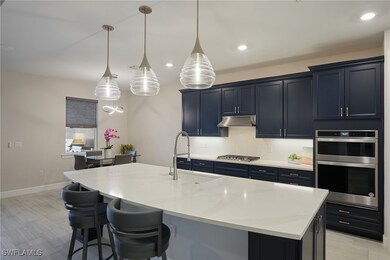 Kitchen with stainless steel appliances, sink, a c