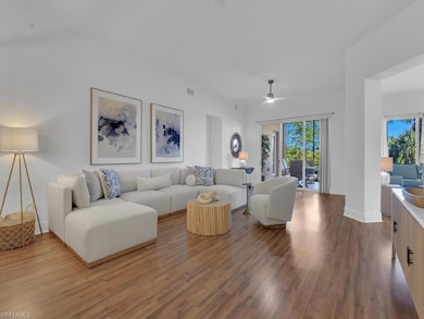 Living area with visible vents, baseboards, ceiling fan, and wood finished floors