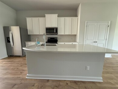 Kitchen featuring appliances with stainless steel