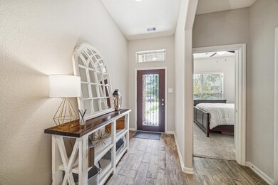 A view of the entryway. Secondary bedroom is to th