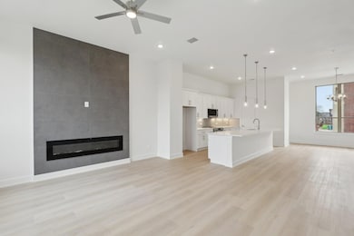 Unfurnished living room featuring a fireplace, vis